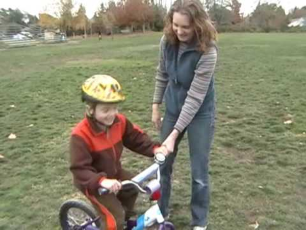 teaching kid to ride bike without training wheels